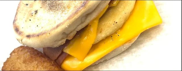 Bacon Egg Patty & Cheese On English Muffin.